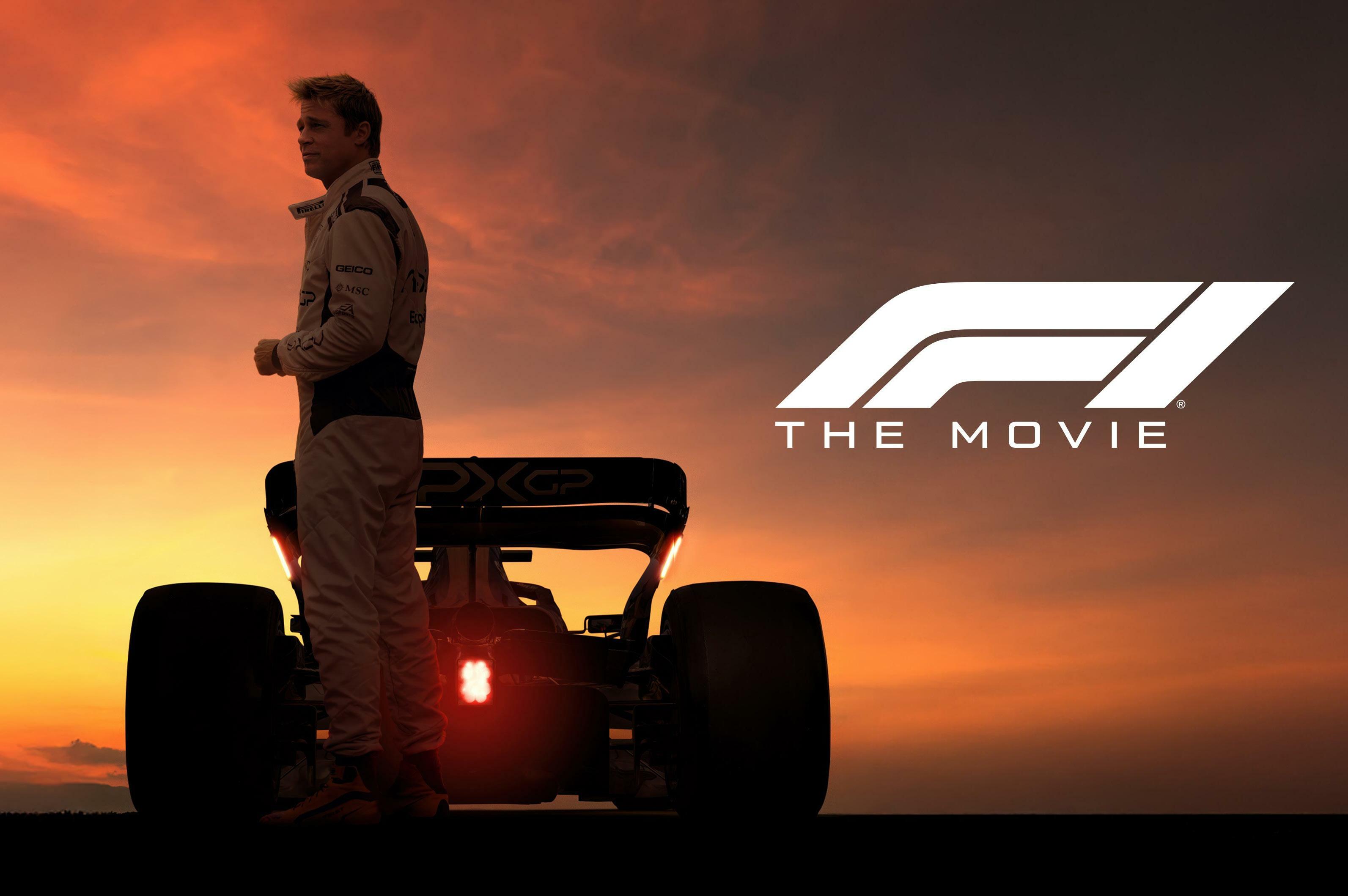 A promotional image for F1: The Movie, featuring Sonny Hayes (Brad Pitt) standing in front of a Formula 1 car